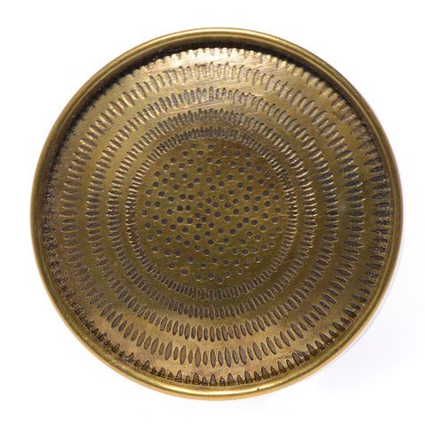 Brass pull with starburst pattern