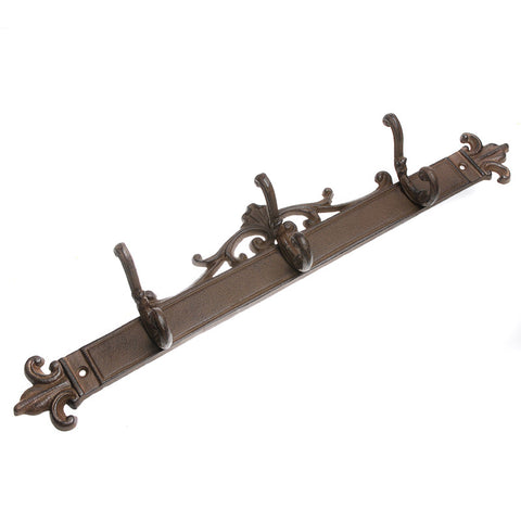 Long cast iron ornate hooks in a row