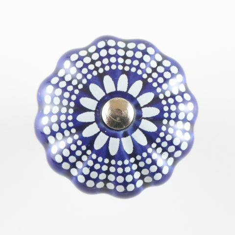 Navy blue ceramic pumpkin shaped pull with white dots