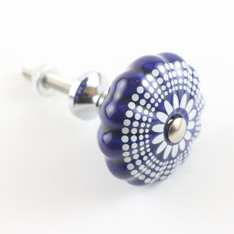 Navy blue ceramic pumpkin shaped pull with white dots