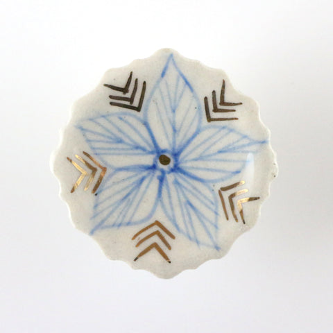 Hand painted ceramic pull with blue and gold flower motif