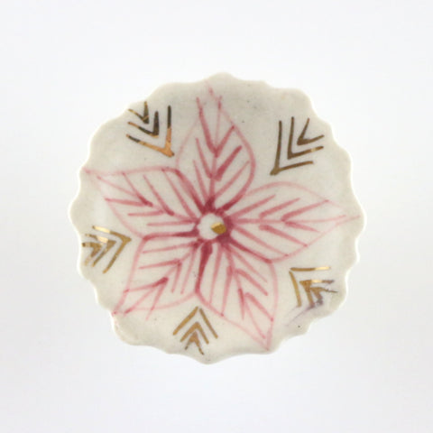 Saucer shaped ceramic pull with hand painted, pink and gold flower motif